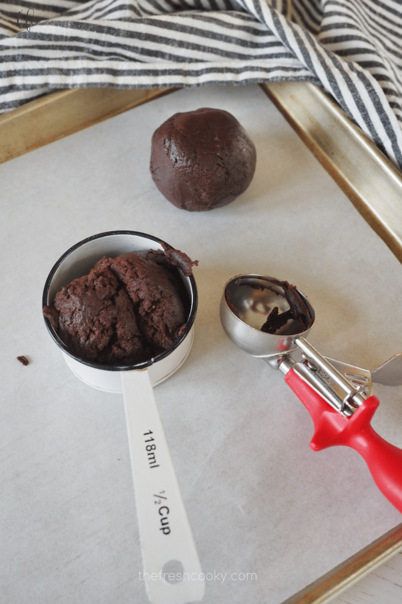 For size reference, you are making enormous Oreo crumbl cookies, ½ cup measure filled with Oreo cookie dough. 