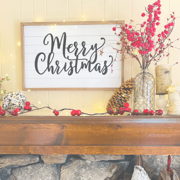 Image of Christmas decorated mantle, with Merry CHristmas sign.