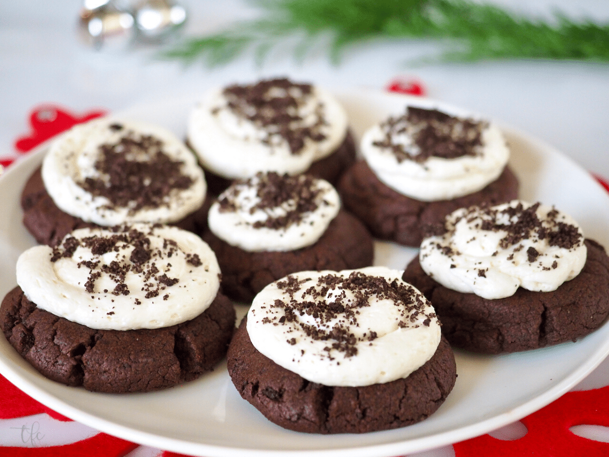 Christmas Crumbl Cookie Recipe Oreo Crumbl Cookies on a plate with Christmas decor around.