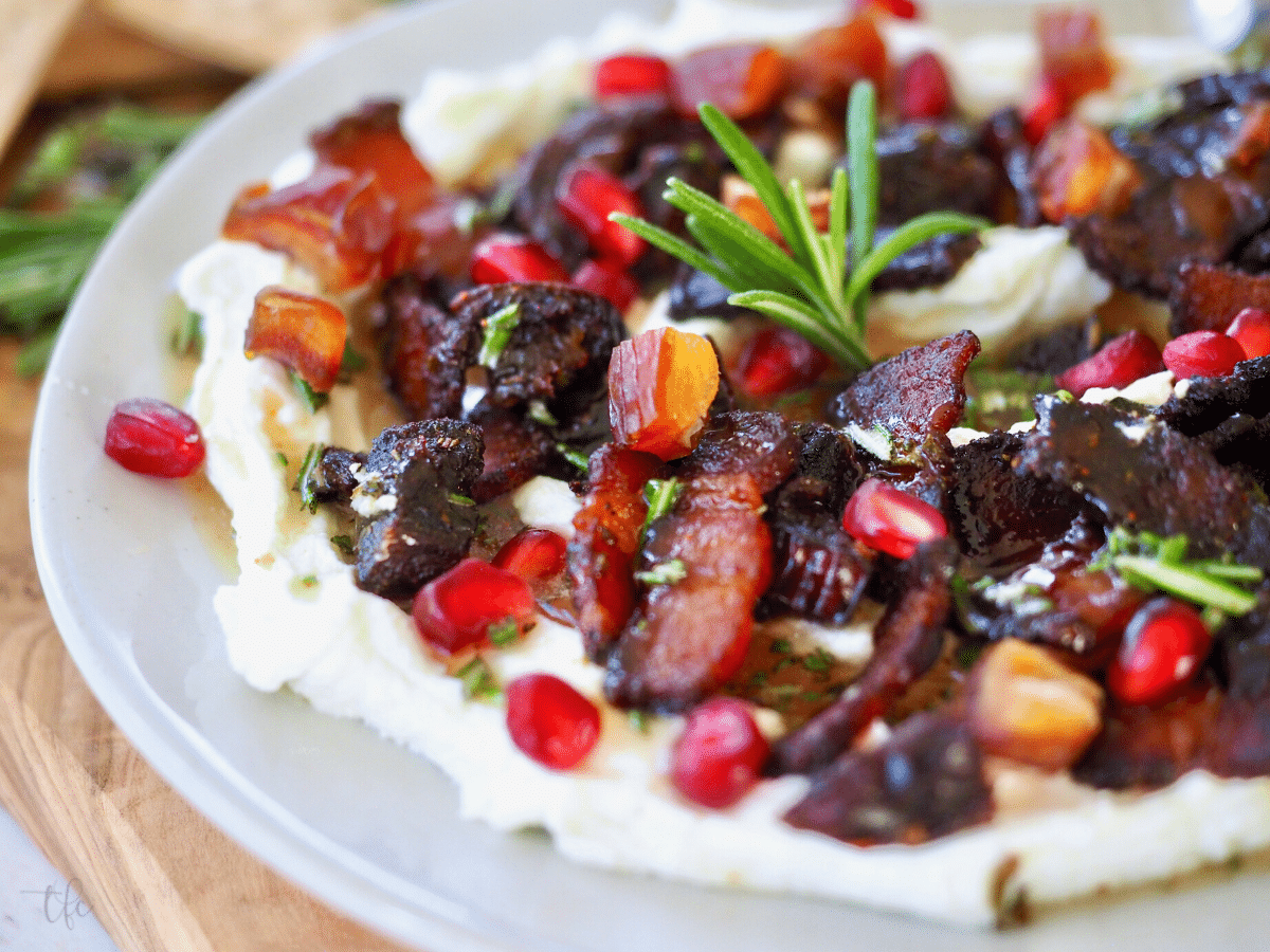 Whipped Goat Cheese Dip with sprinkles of pomegranate arils on top.