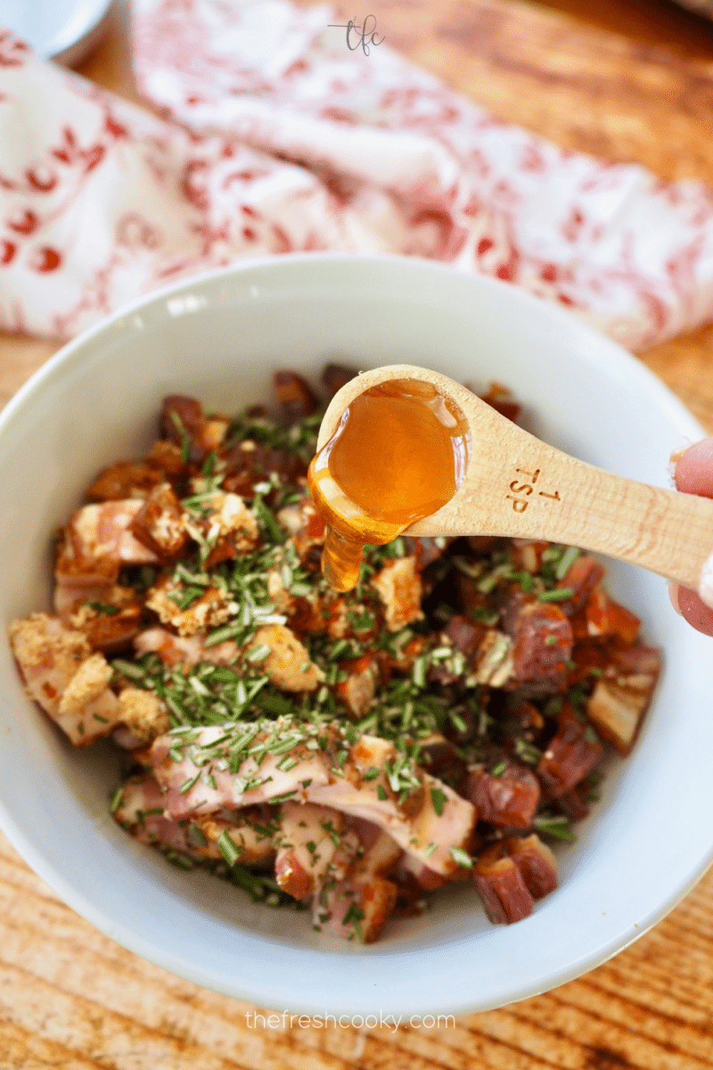 Adding honey over bacon and rosemary. 