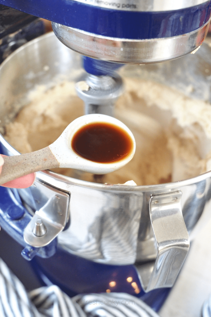 Adding vanilla extract to oreo crumbl cookie dough. 