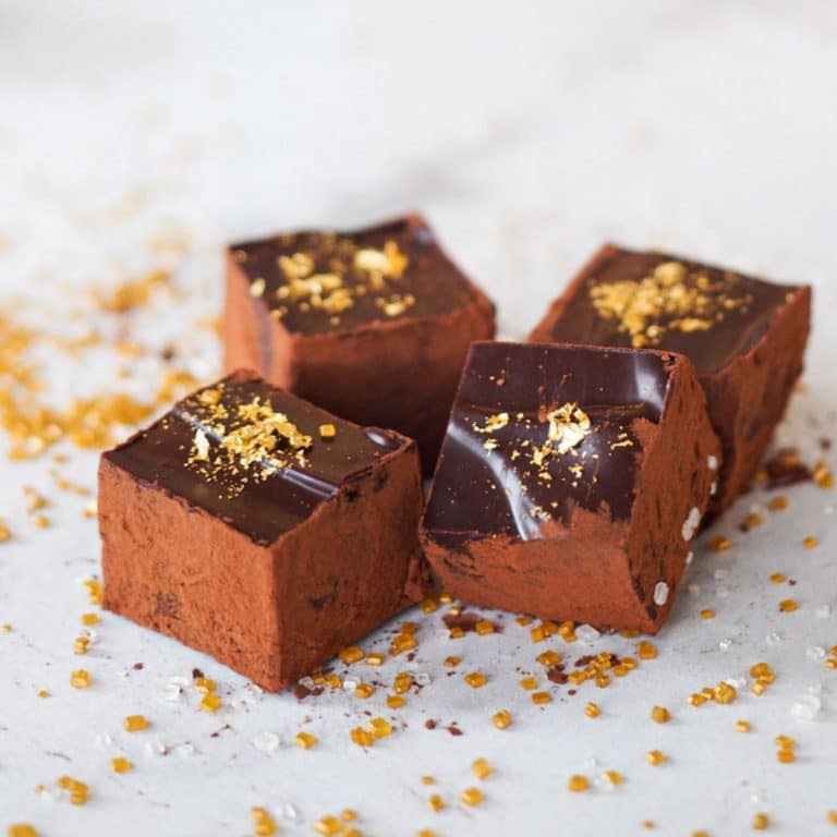 Champagne chocolates decorated with gold leaf.