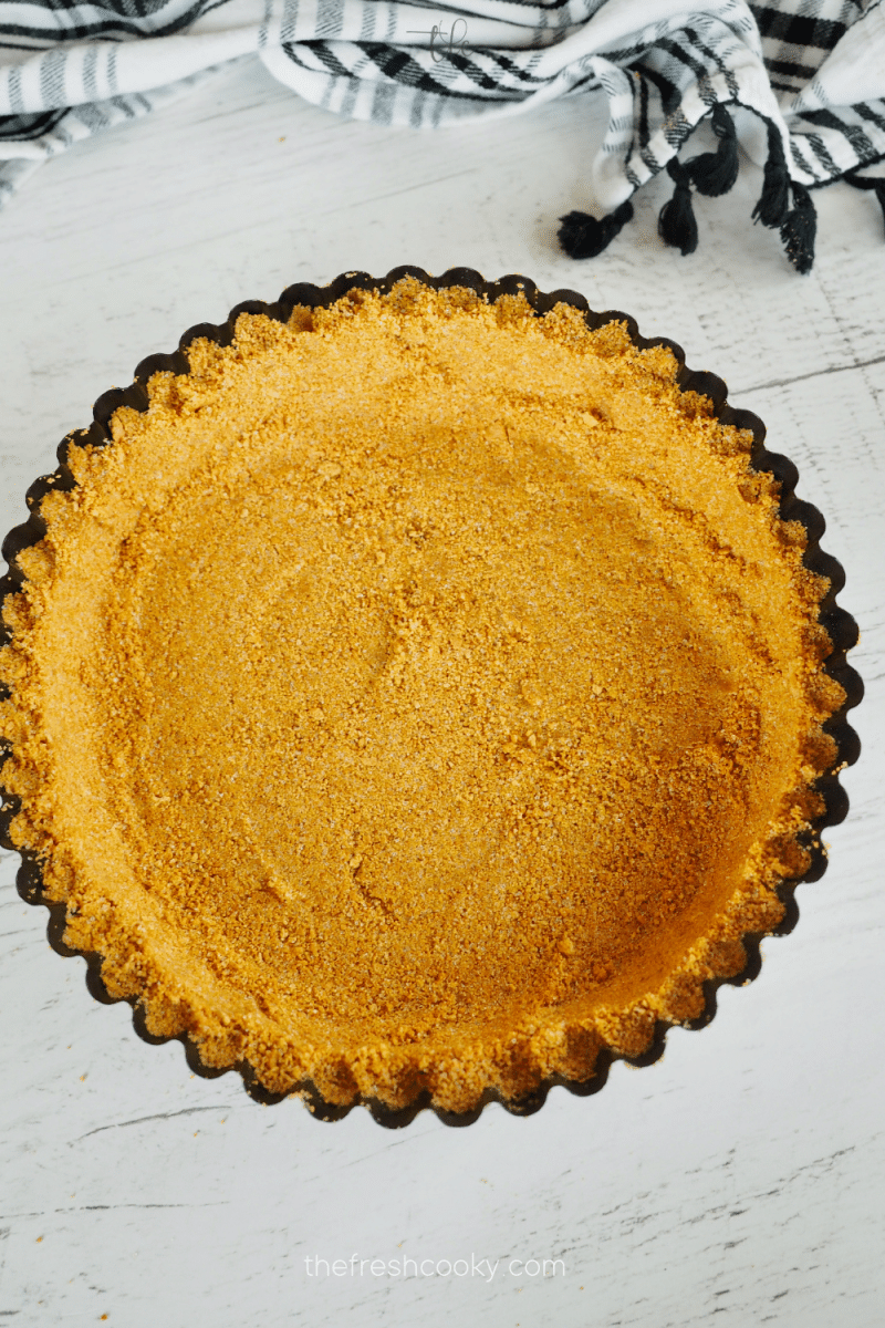 Graham cracker crust pressed into deep dish tart pan. 