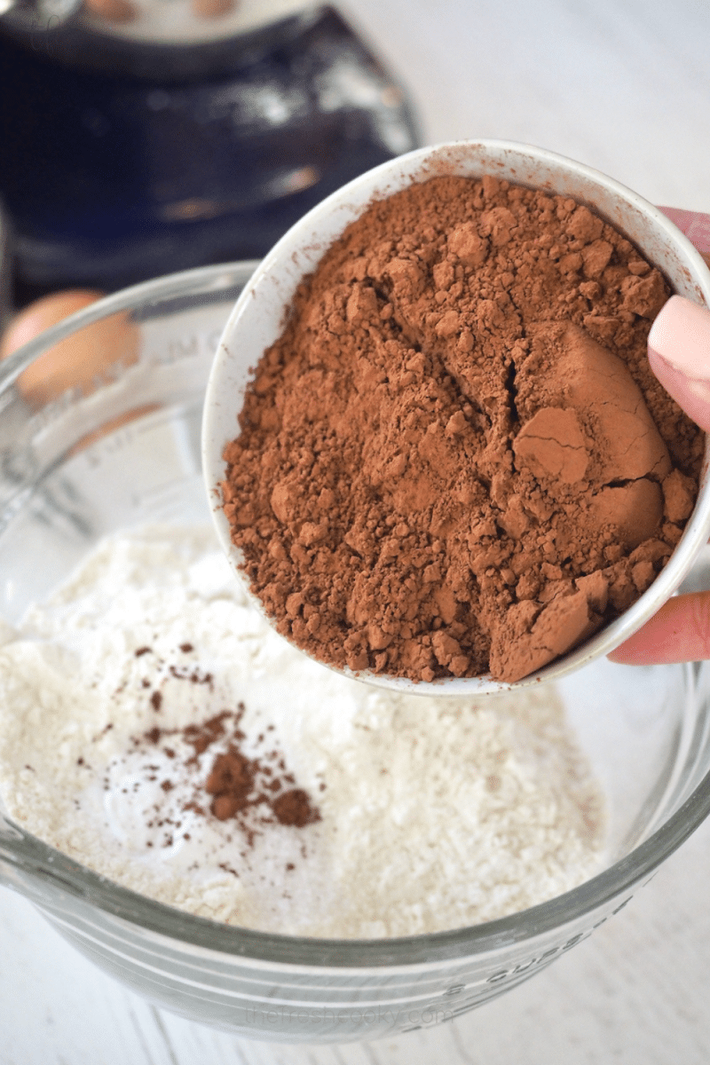 Adding cocoa powder to flour and leavening ingredients 