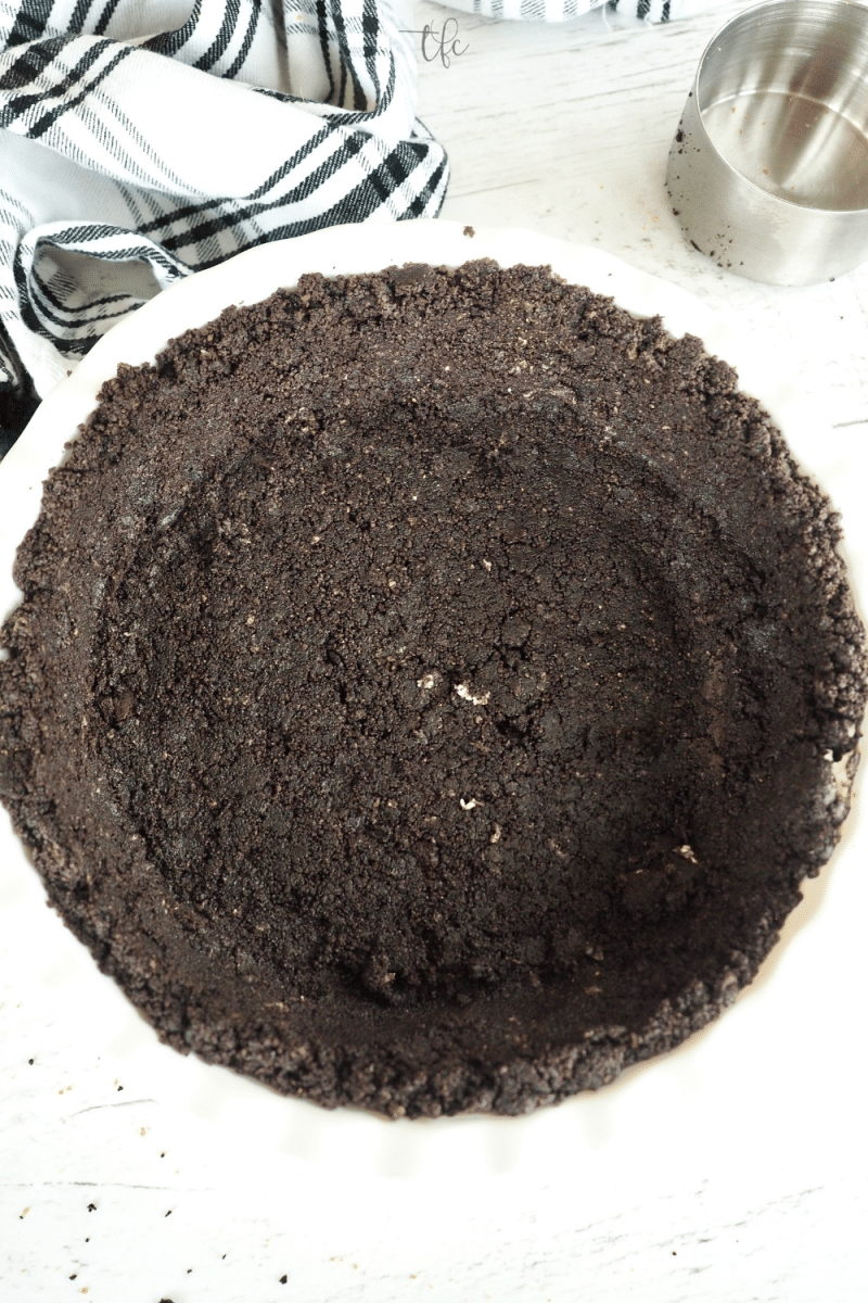 Oreo Cookie Crust pressed into deep dish pie plate. 