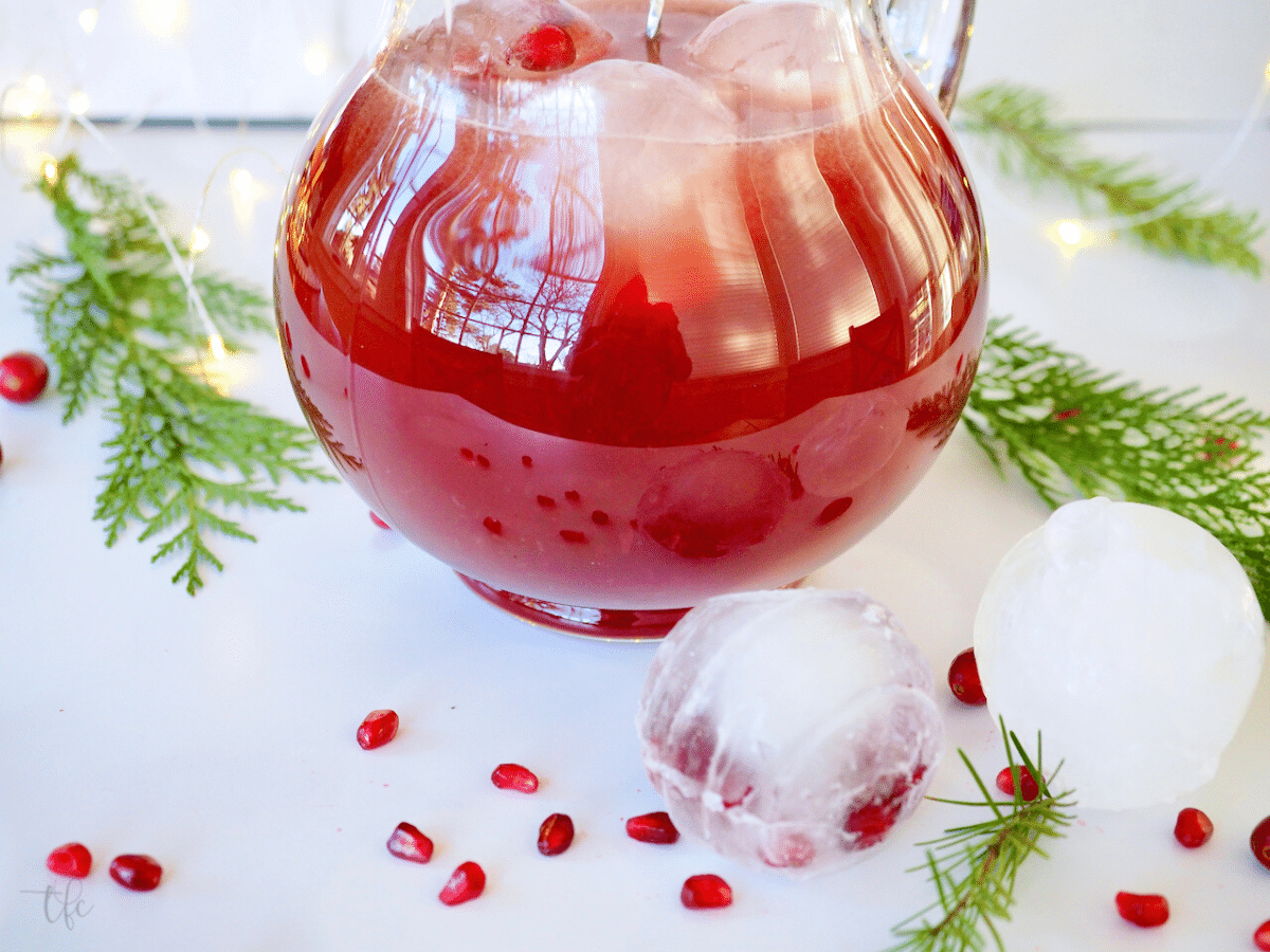 Pomegranate Cranberry Punch in pitcher with ornament ice molded.