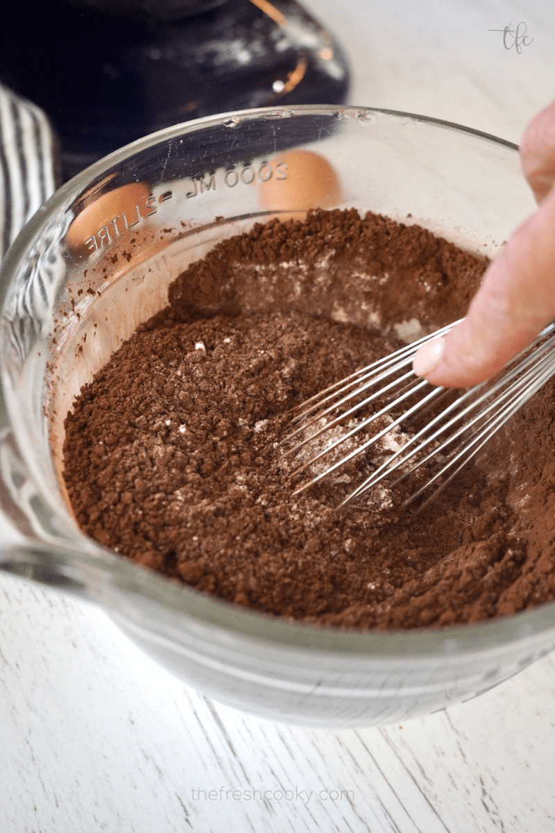 Whisking dry ingredients together for Oreo crumbl cookies. 