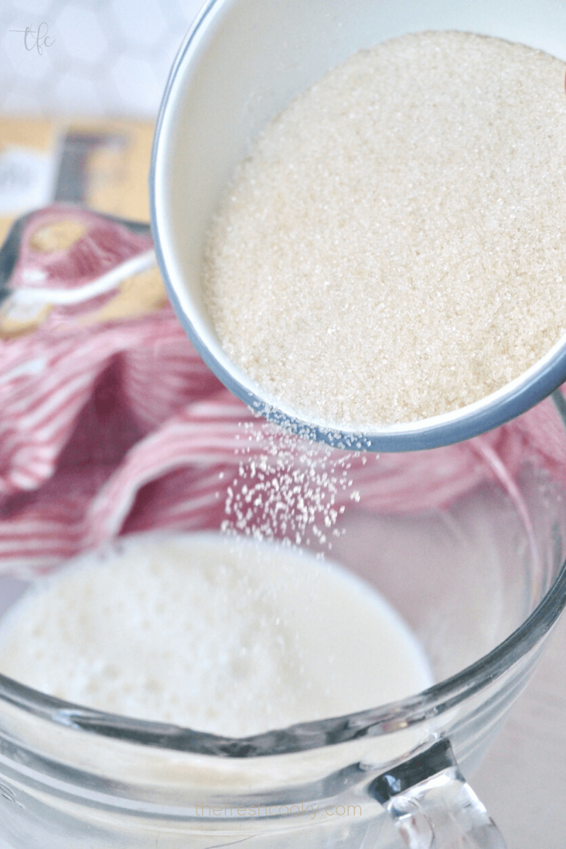Pouring sugar into milk for Ferrero Rocher Ice Cream.