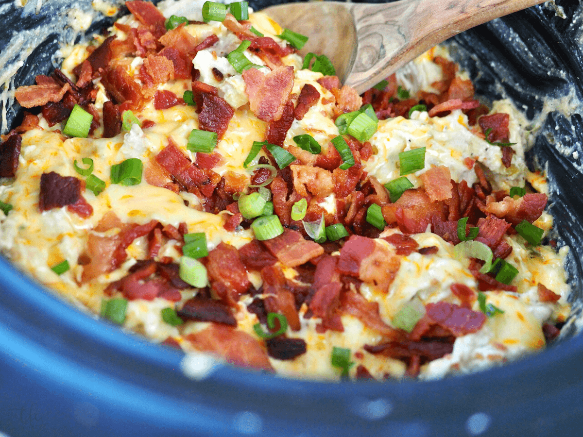 With added bacon and green onions on top, crockpot ranch chicken.