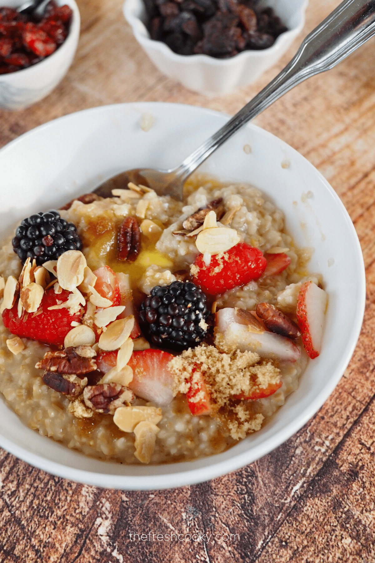Best Instant Pot Oatmeal recipe with toppings, butter and a spoon in a bowl.