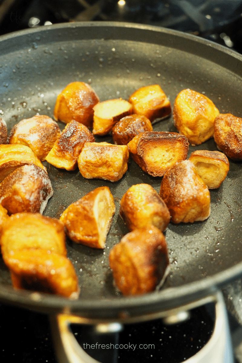 Pretzel bite croutons in skillet with a little butter and kosher salt for topping the creamy tomato bisque soup. 