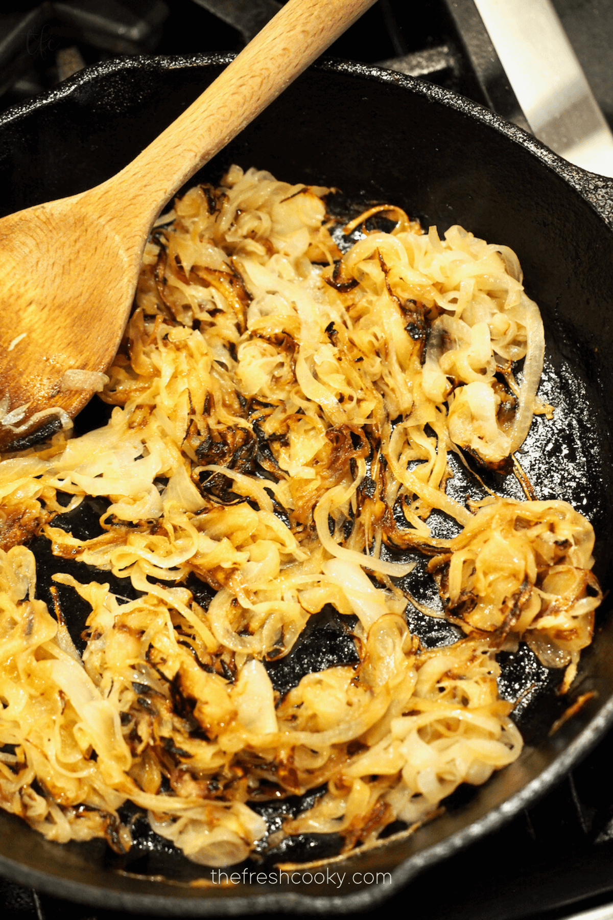 Onions caramelizing in cast iron pan.