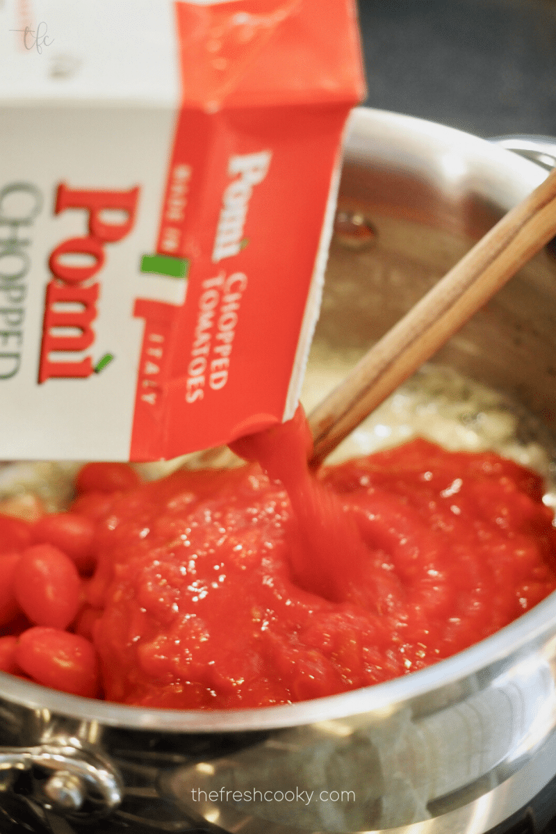 creamy tomato bisque recipe using canned tomatoes in saucepan. 
