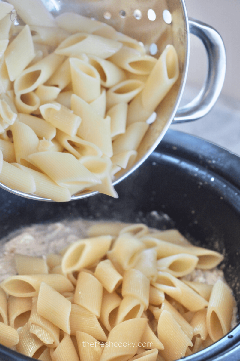 Pour in drained, cooked pasta and stir into Olive Garden Chicken. 