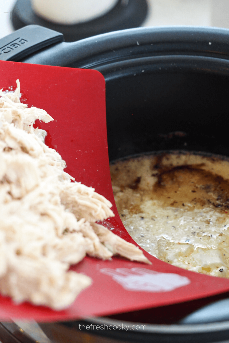 Add the shredded chicken back to slow cooker for crock pot Olive Garden Chicken.