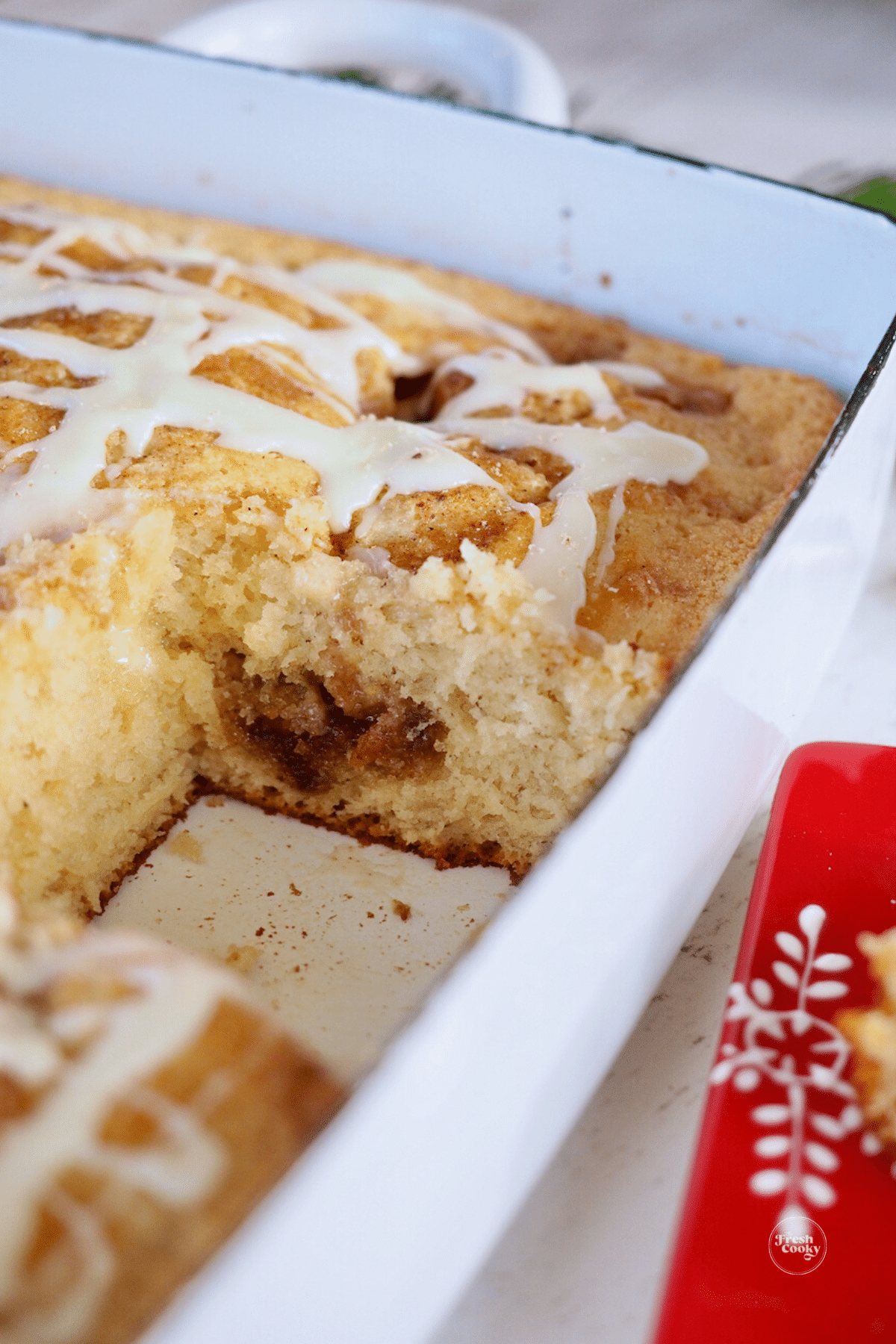 Eggnog coffee cake with streusel with square removed from pan.