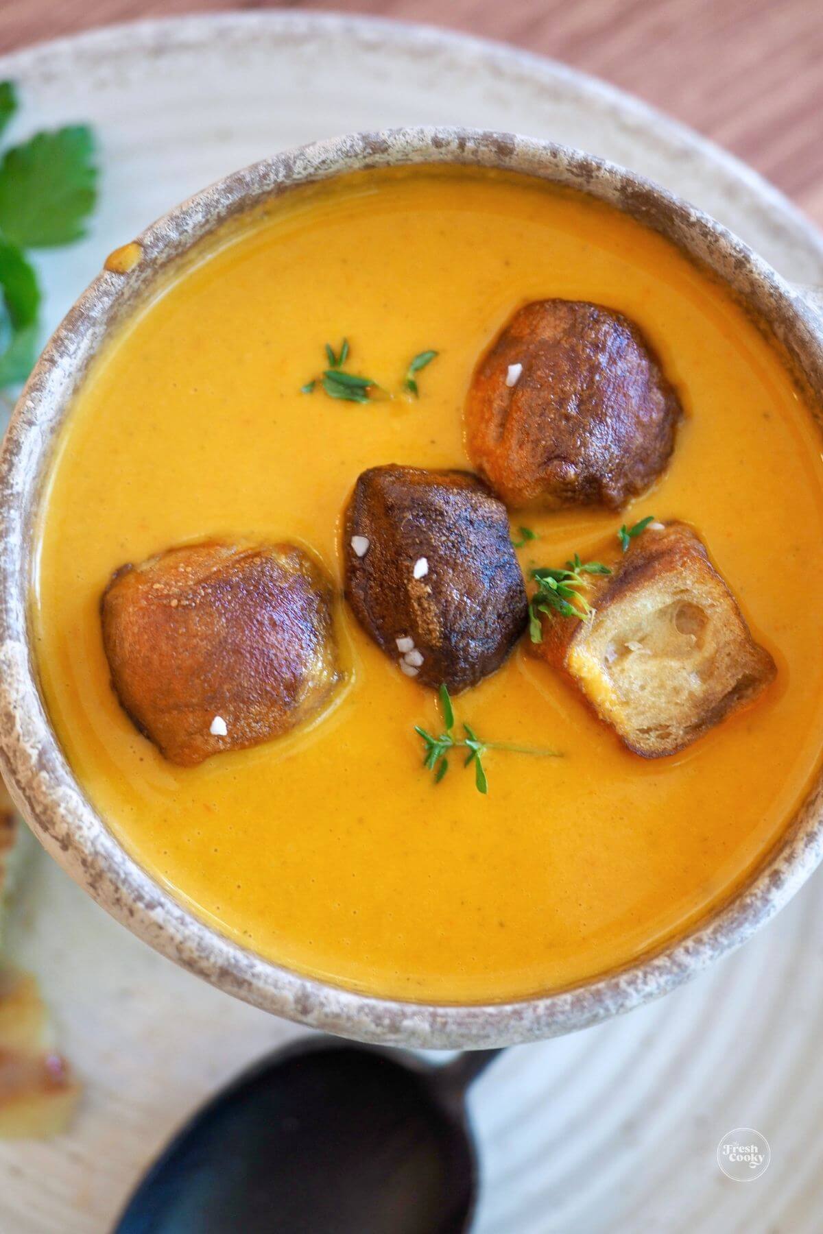 Creamy homemade tomato bisque with basil.