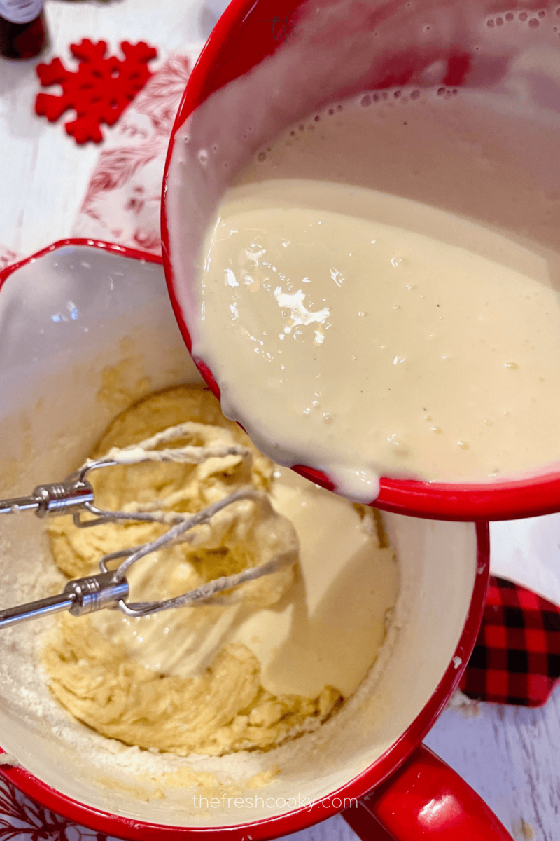 Slowly pour eggnog mixture into batter alternately with flour mixture for eggnog coffee cake. 