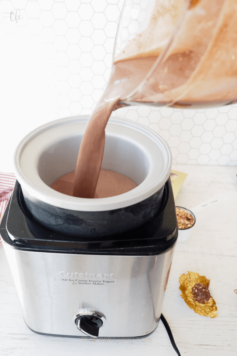 Pouring Ferrero Rocher Ice Cream batter into ice cream freezer. 
