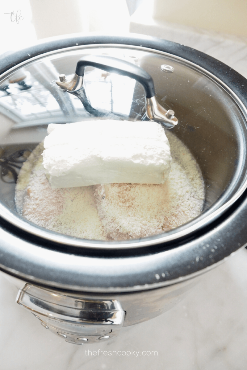 Olive Garden Crock Pot Chicken covered and in slow cooker.