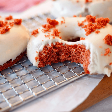 Red Velvet Donut with bite taken out of it.