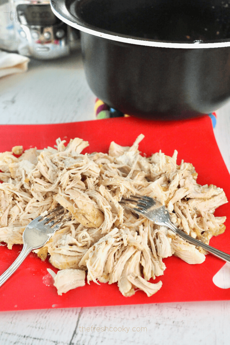 Using two forks shred the chicken and return to crockpot. 