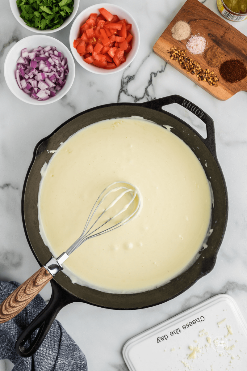 Whisk until all cheese is melted for queso.