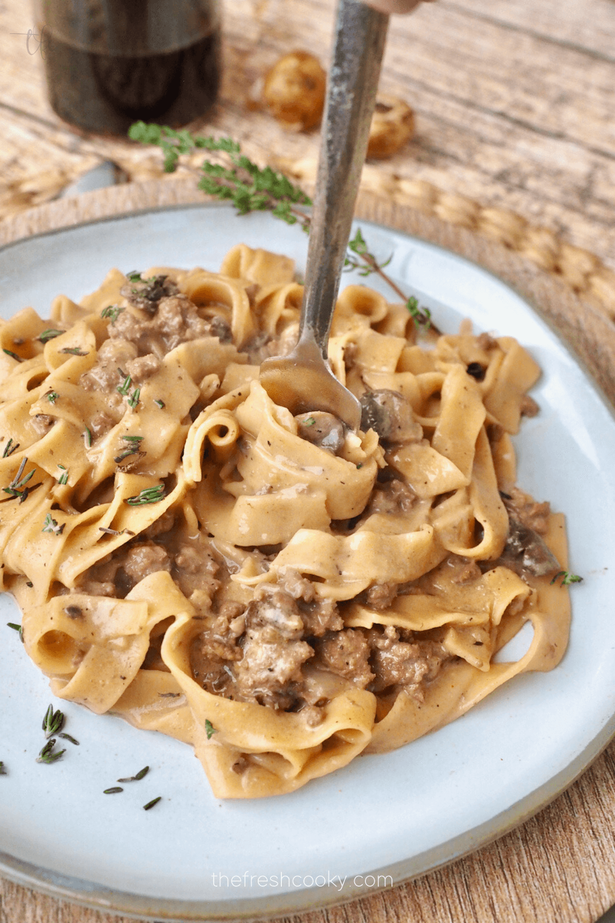 Fork twirling noodles Adding sour cream to finished for Instant Pot Ground Beef Stroganoff.