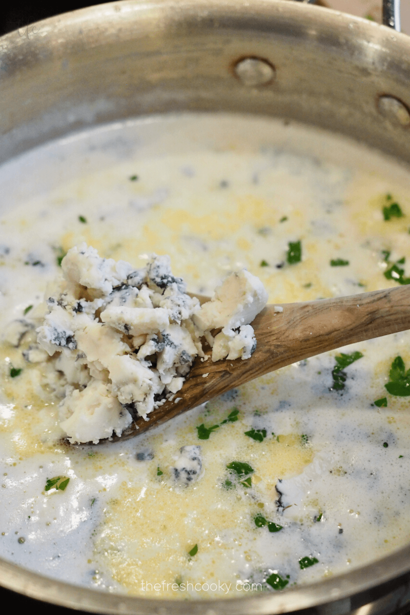 Add gorgonzola cheese to Olive Garden Alfredo sauce. 