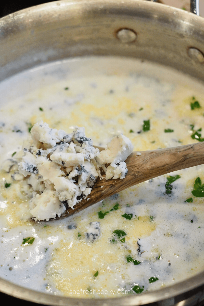 Add gorgonzola cheese to Olive Garden Alfredo sauce.