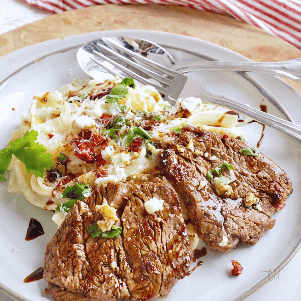 Olive Garden Steak Alfredo with fettuccine and balsamic drizzle.