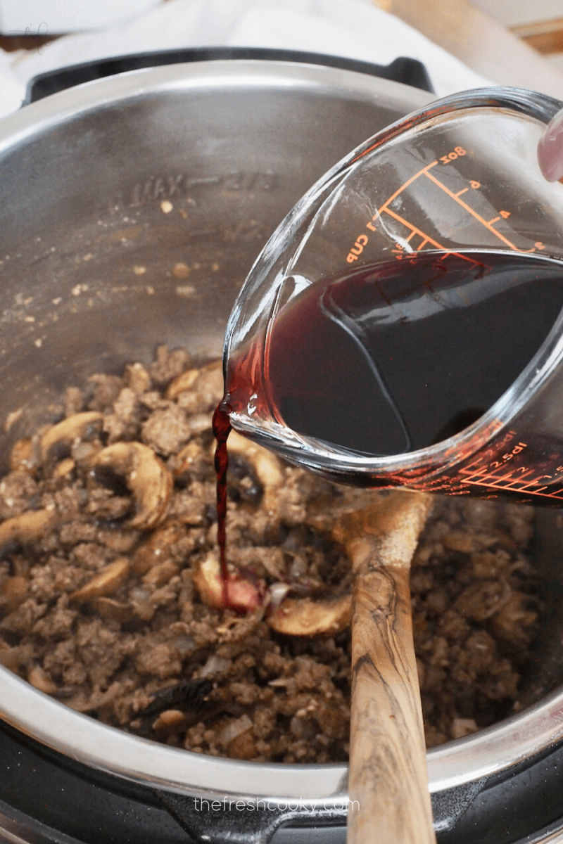 Deglaze pot with red wine (or broth) for Instant Pot Ground Beef Stroganoff.