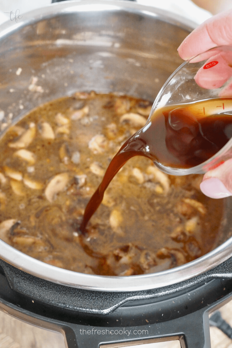 Pour in Worcestershire sauce for Instant Pot Ground Beef Stroganoff.