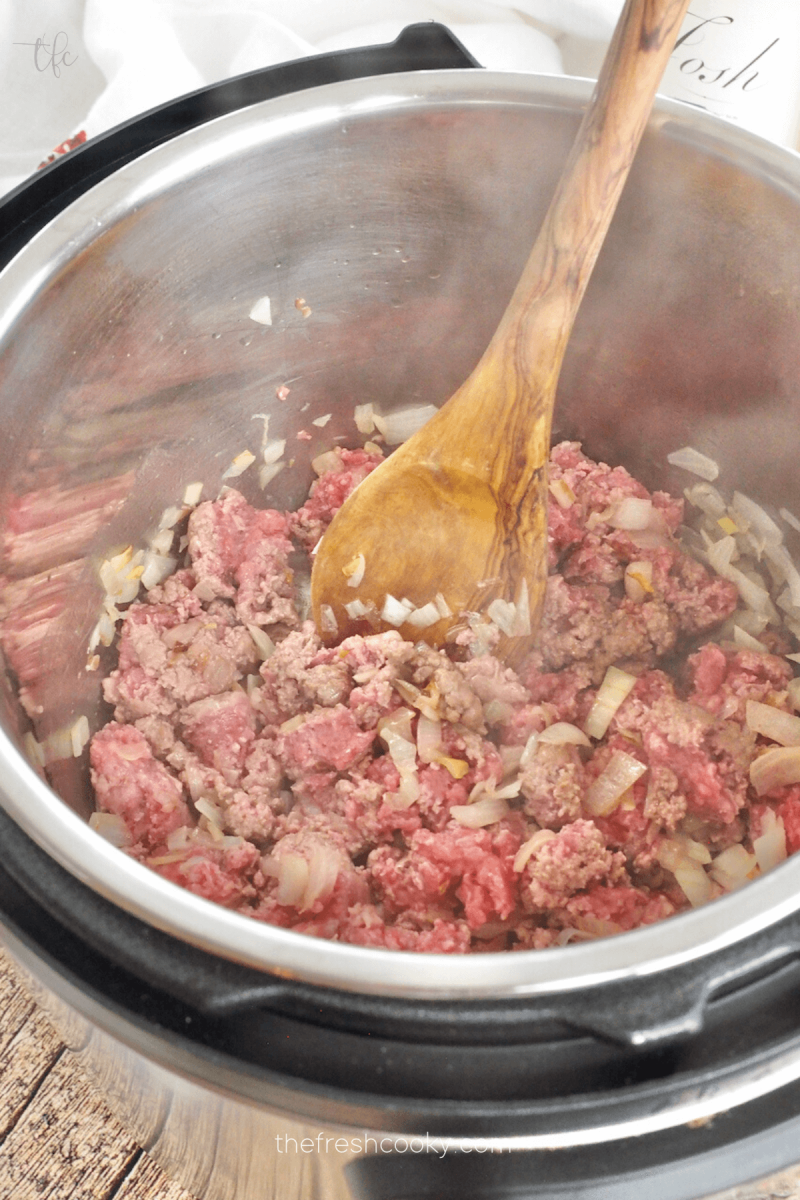 Browning ground beef and onions for Instant Pot Ground Beef Stroganoff.