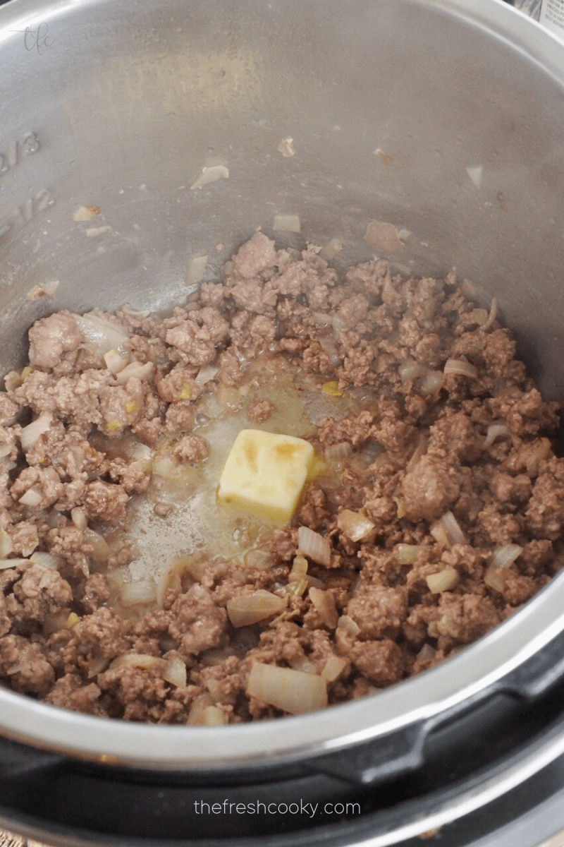 Adding butter to saute mushrooms for Instant Pot Ground Beef Stroganoff.