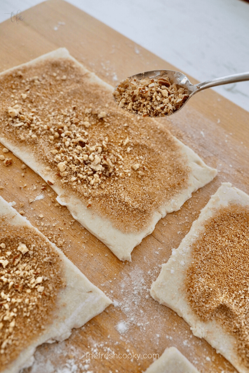 Add optional crushed pecans if desired for mini king cakes.