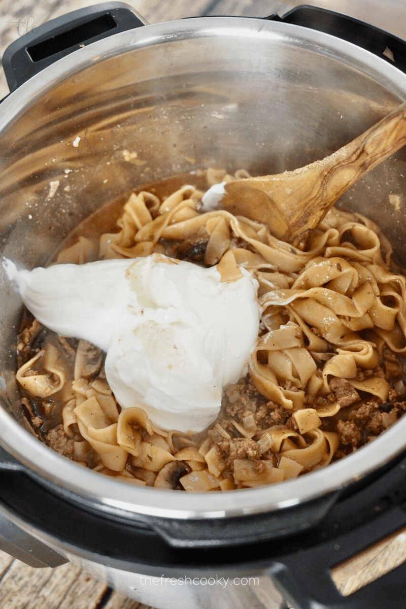 Adding sour cream to finished for Instant Pot Ground Beef Stroganoff.
