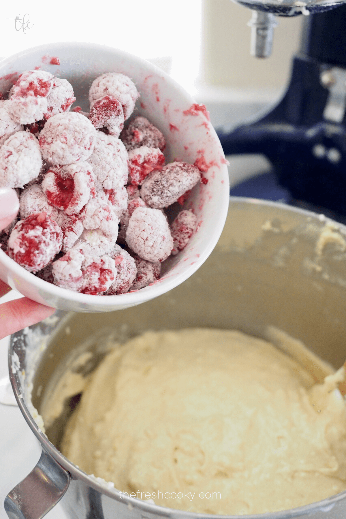 Add flour coated raspberries to cake batter. 