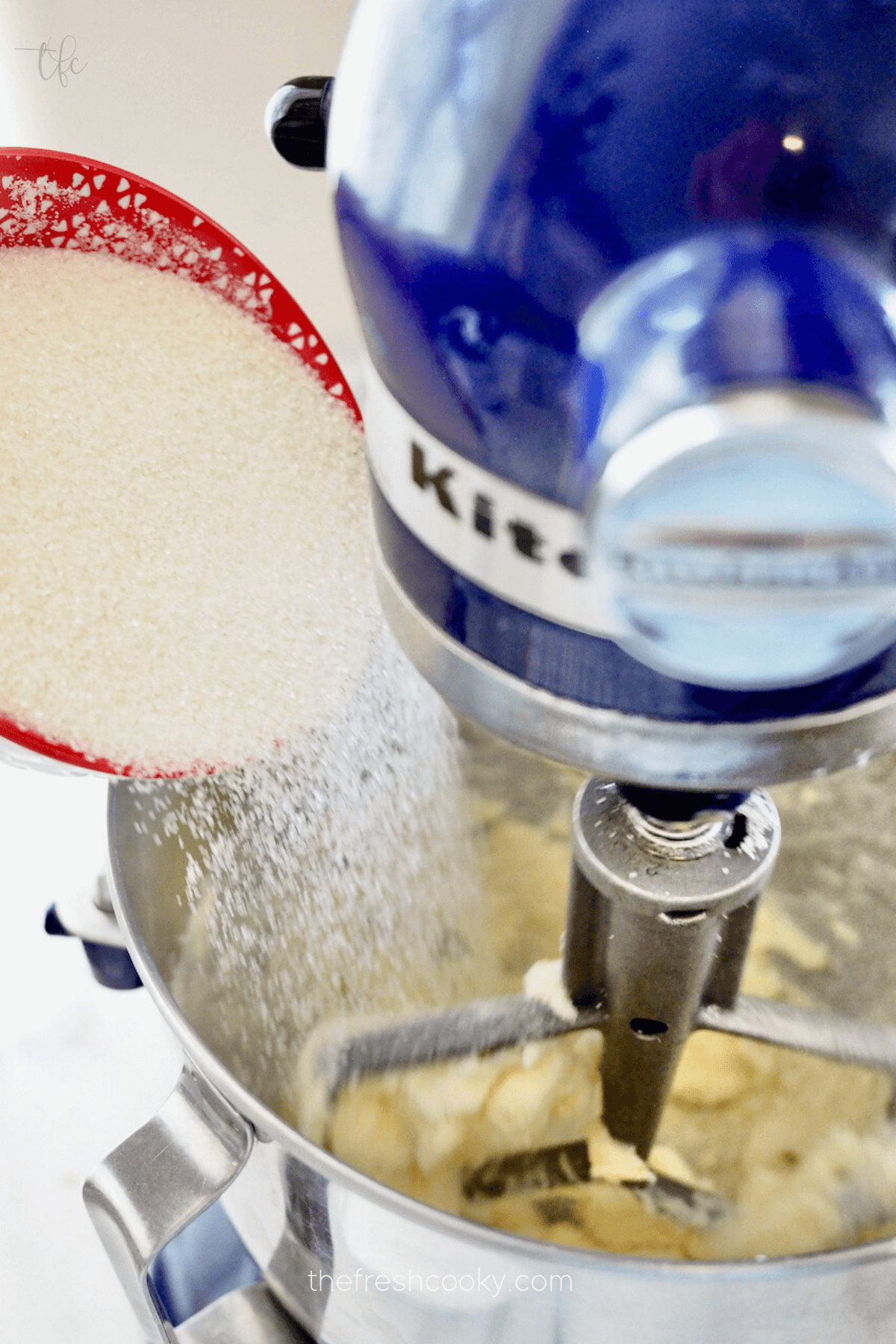 Add sugar to creamed butter mixture.