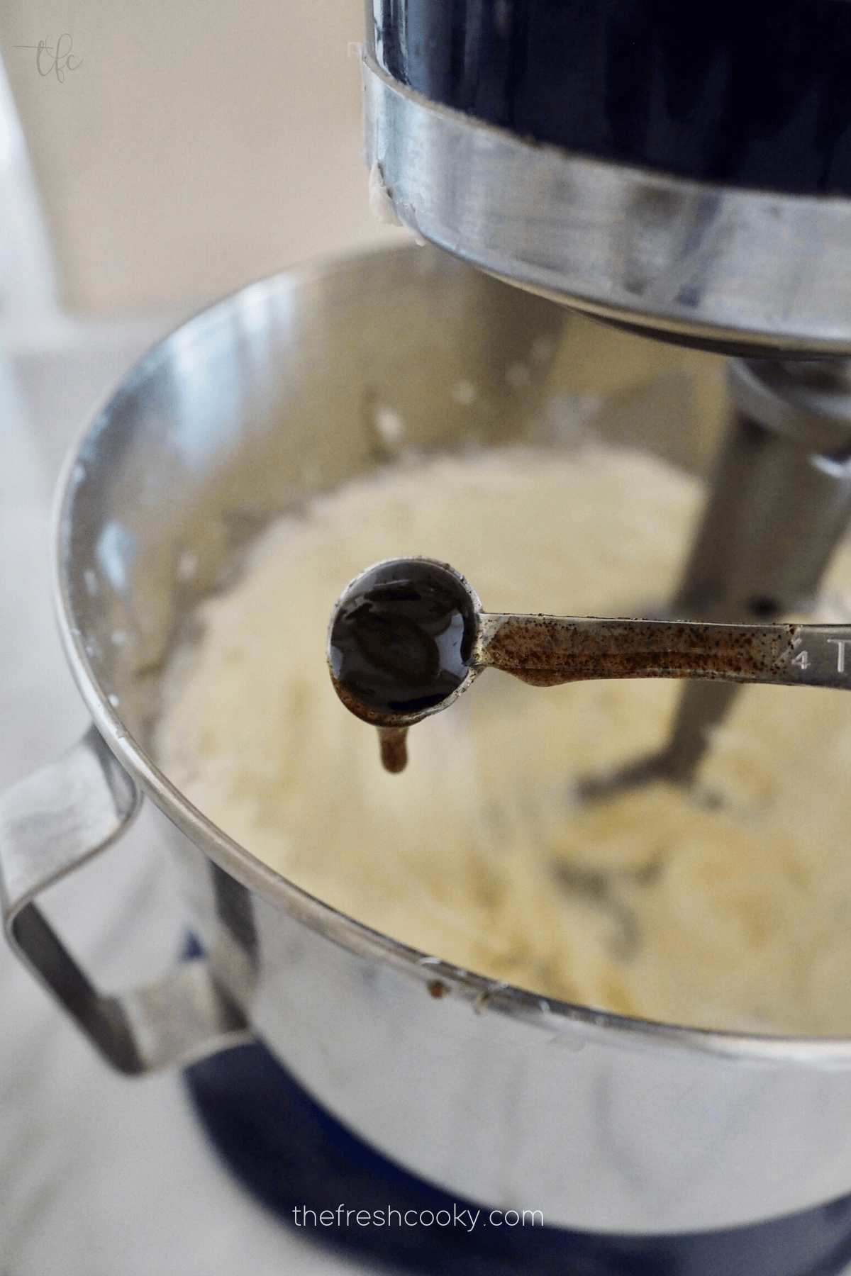 Add vanilla bean paste to cream cheese frosting mixture. 