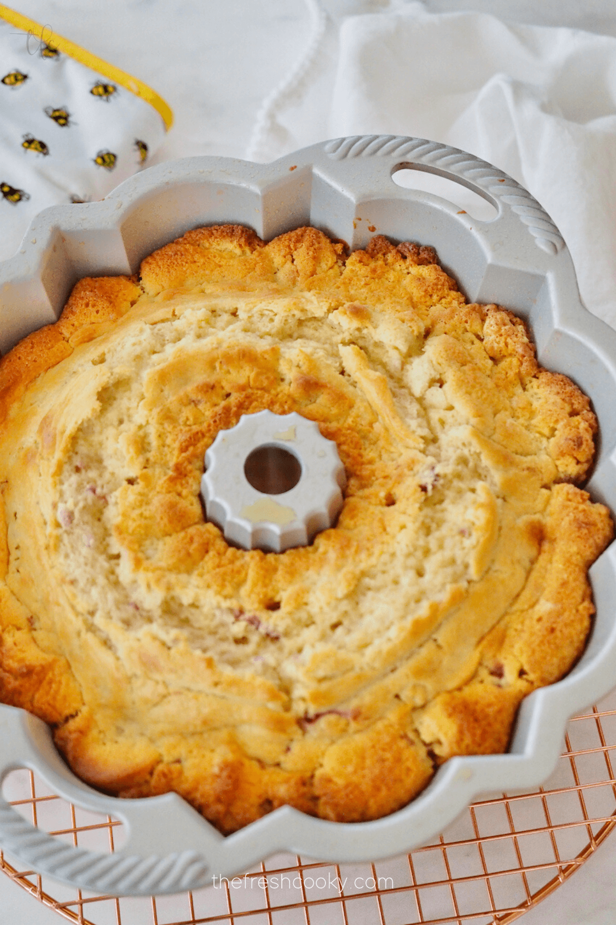 Baked white chocolate raspberry bundt cake.
