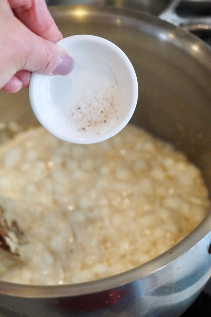 Pouring salt into marshmallow goo - melted marshmallow and butter mixture.