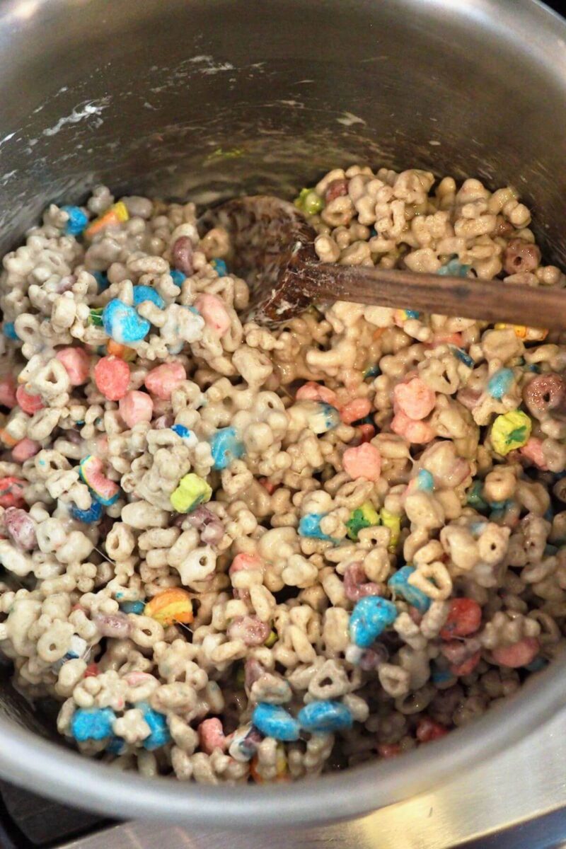 Stir Lucky charms cereal into marshmallow mix until coated.