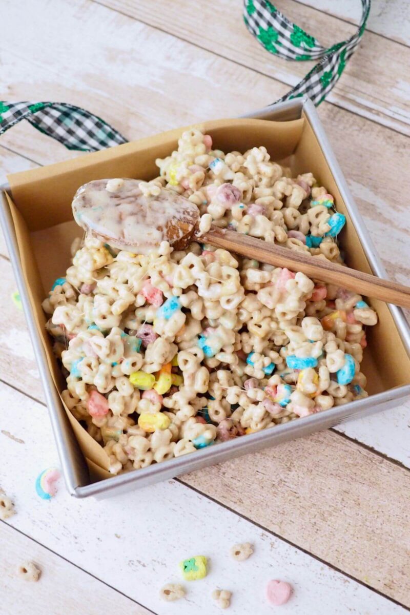 Pour Lucky Charms treats into prepared pan.