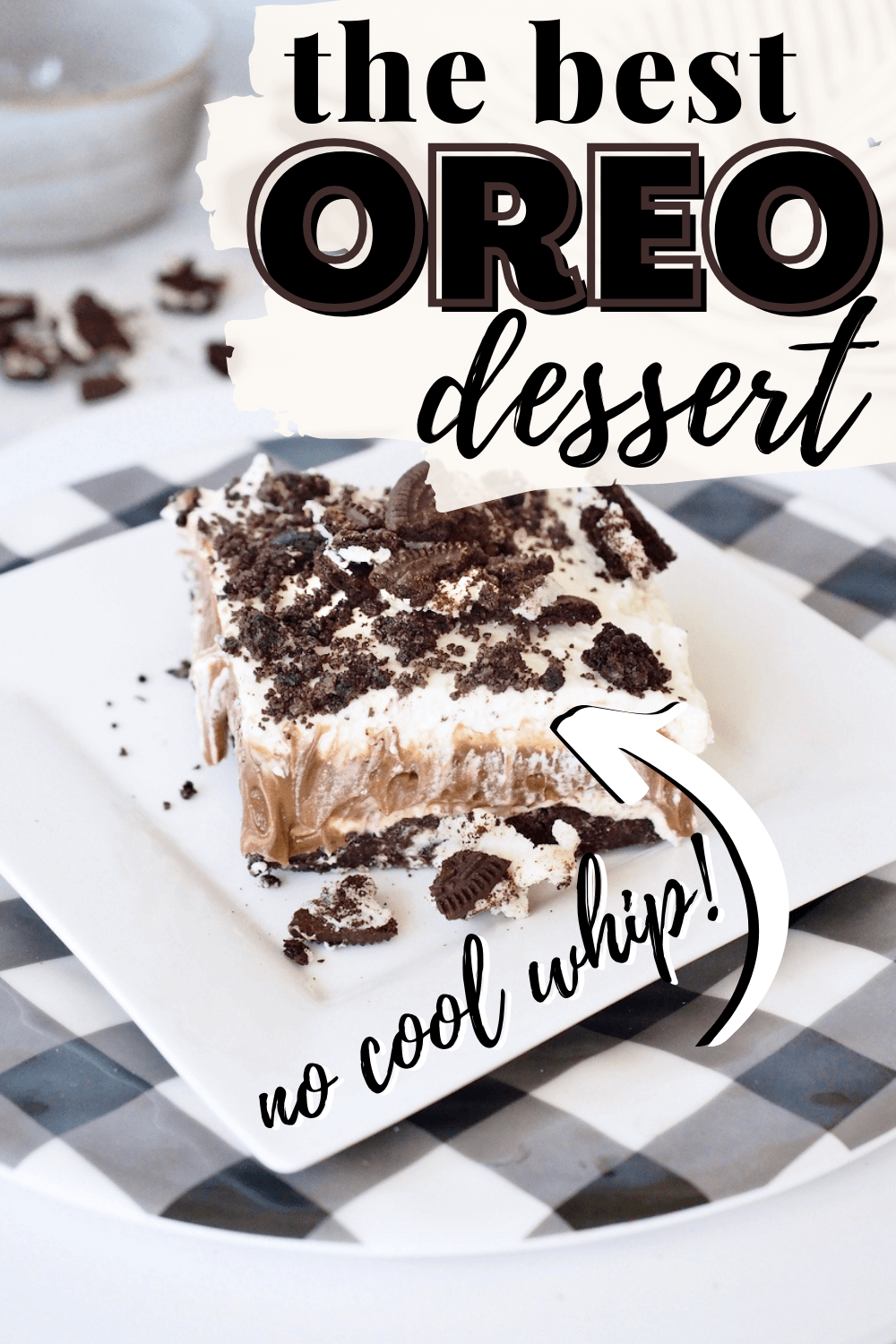 Pin for the best Oreo Dessert with no cool whip, slice on a plate with crumbs of Oreos.