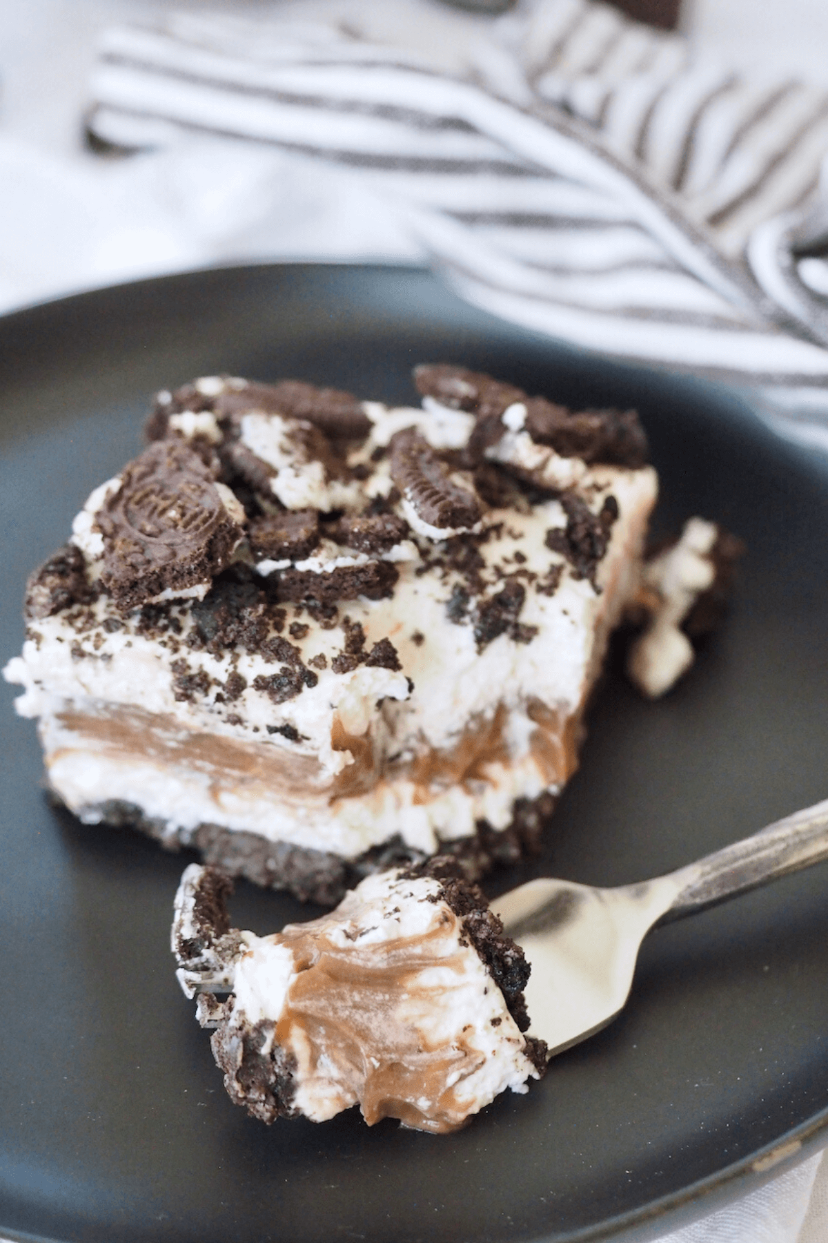 Oreo dessert on plate with bite on fork.