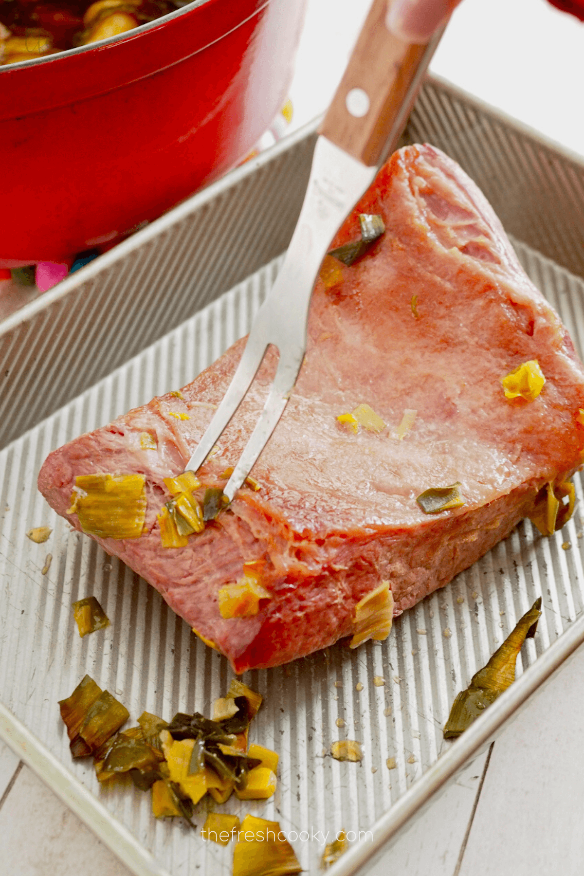 After 4 hours removing corned beef from dutch oven and place in pan for glaze.