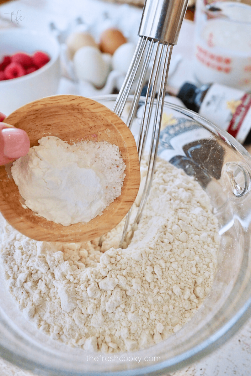Adding baking powder and salt to flour mixture.