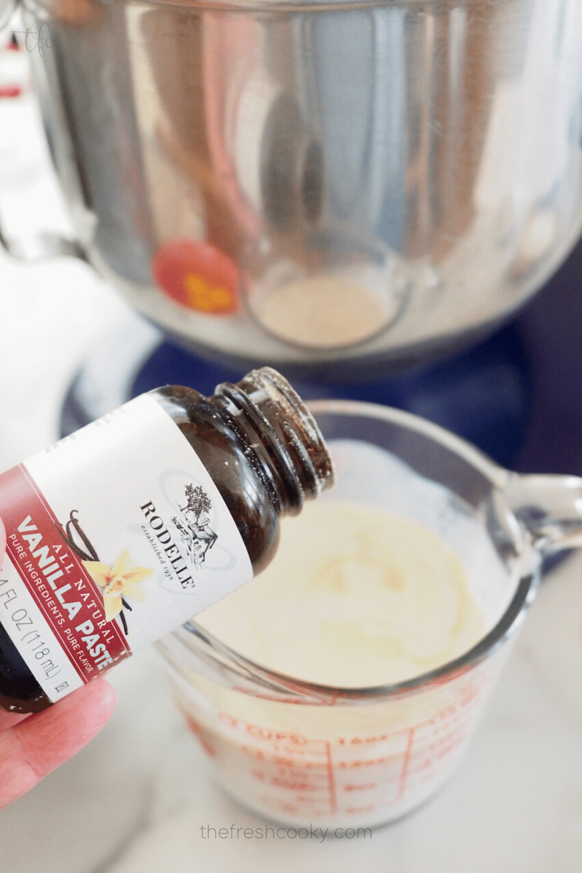 Adding vanilla bean paste to buttermilk mixture. 